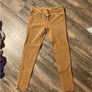 Tan, skinny jeans, American eagle, hole less and no rips